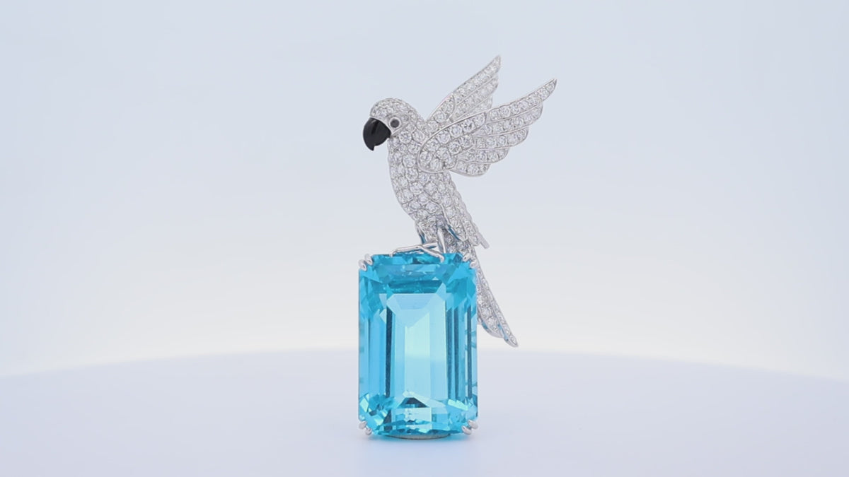 77.38 Carat Blue Topaz Diamond 18K White Gold Bird-on-Rock Brooch