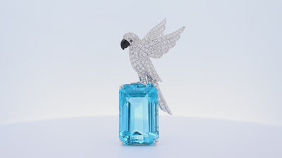 77.38 Carat Blue Topaz Diamond 18K White Gold Bird-on-Rock Brooch